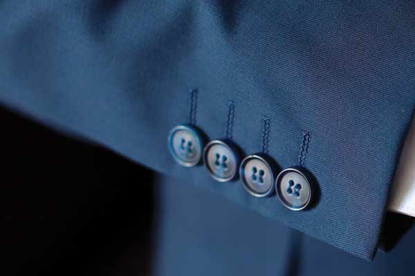 Close up of suit cuff with 4 buttons